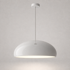 White dome pendant light with a glossy finish, matching white canopy, clear cord, and illuminated underside.