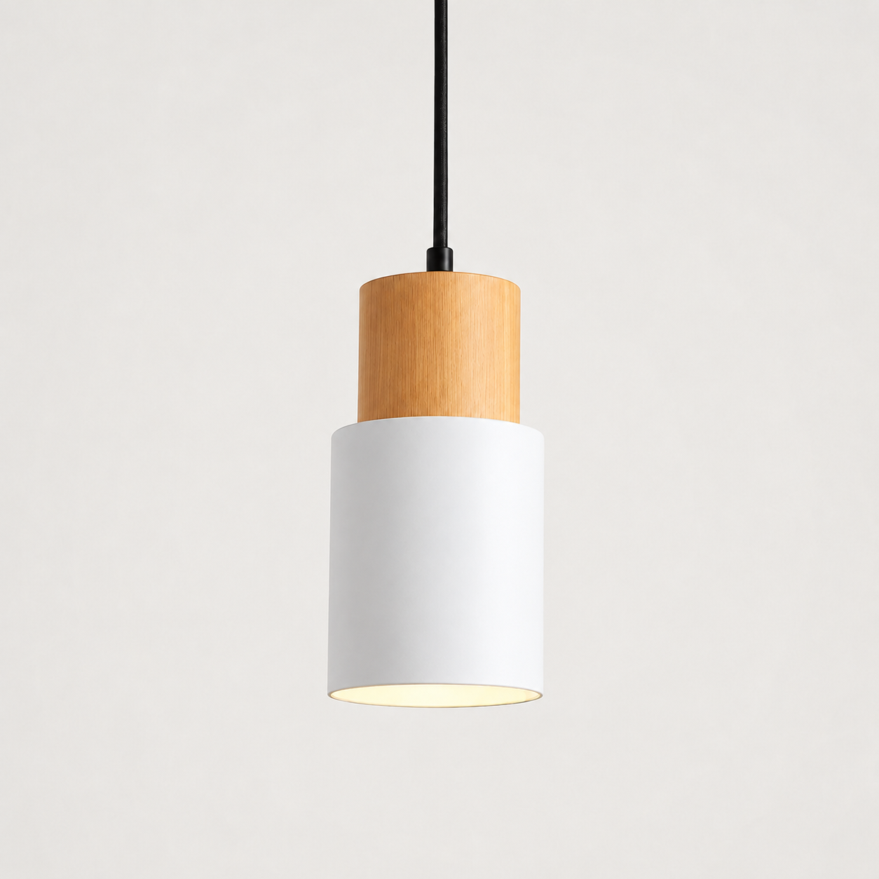 White pendant light with a cylindrical wood and metal body on a clean white background.