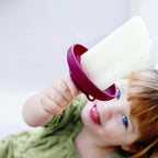 Purple popsicle holder being used with an ice pop
