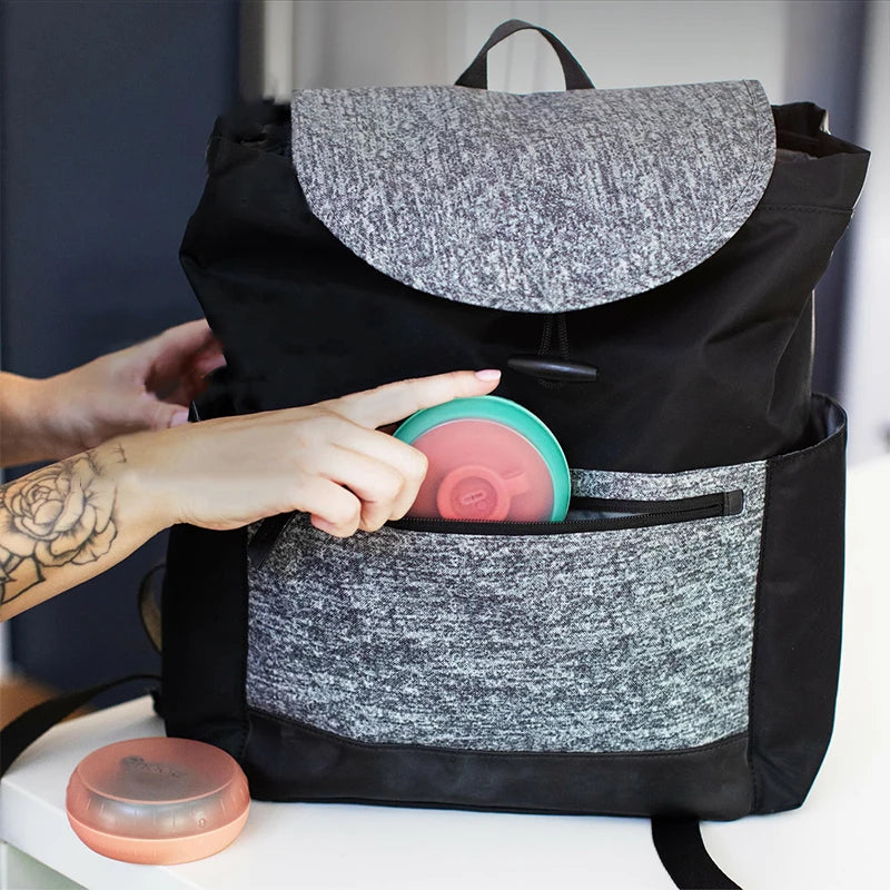 Popsicle holder being tucked into a bag pocket