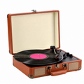 Open brown suitcase record player on a white background