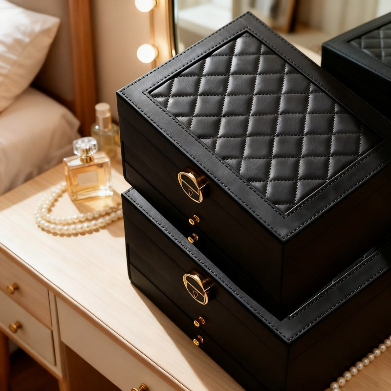 Close view of the black quilted lid and drawer handles