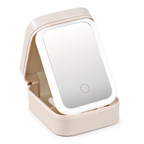 Open white travel makeup case with integrated mirror on white background