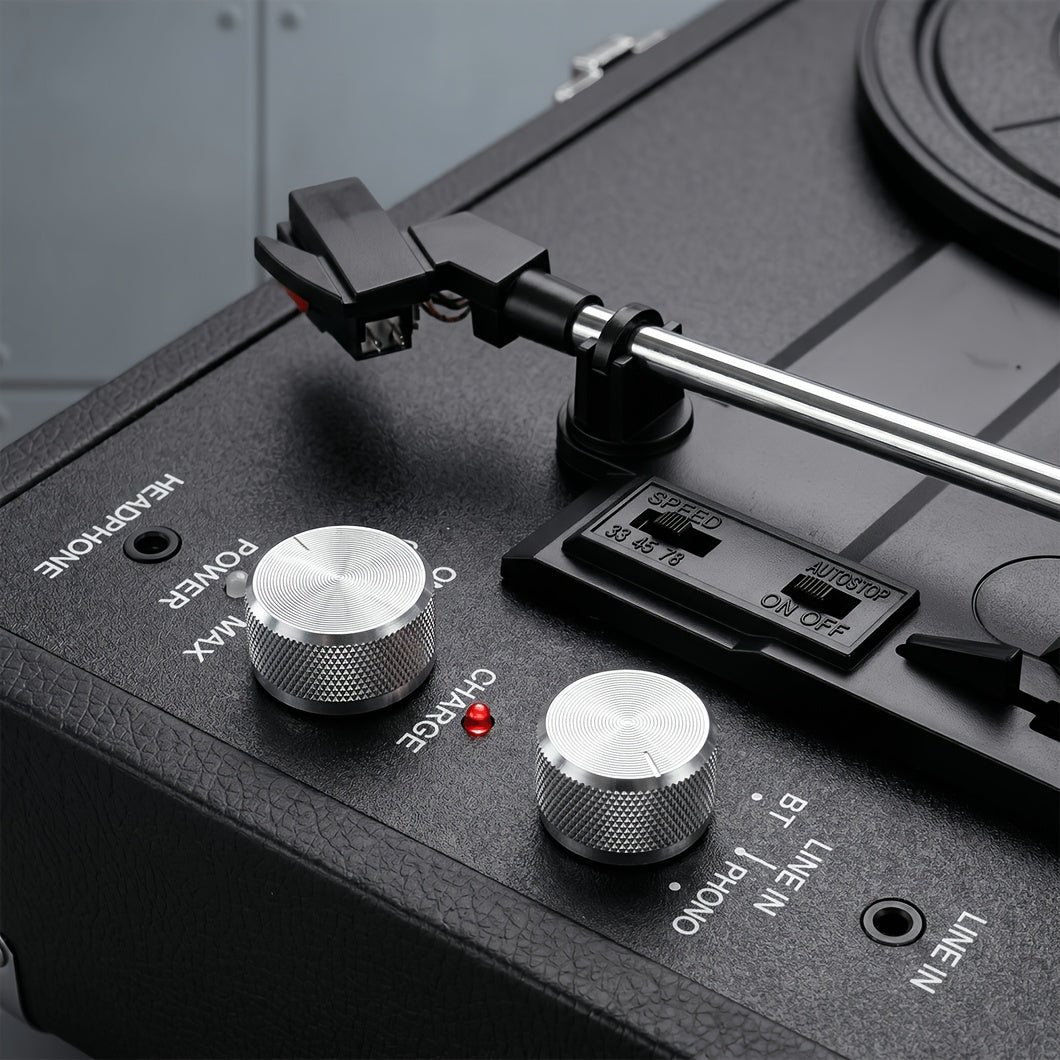 Close view of the speed and volume controls beside the tonearm