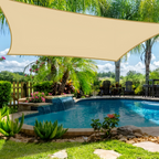 Beige rectangular shade sail installed beside a swimming pool.
