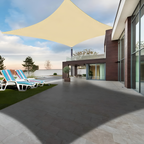 Beige rectangular shade sail covering a modern outdoor terrace.