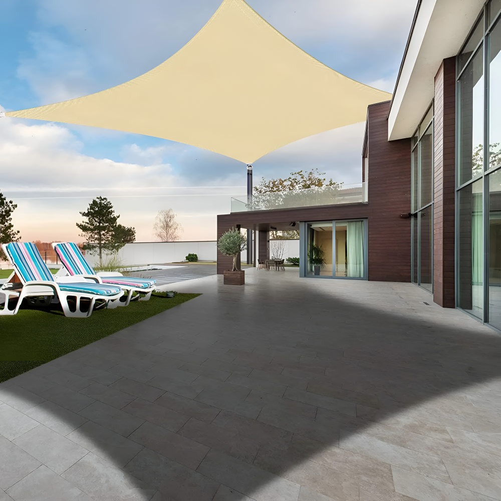 Beige rectangular shade sail covering a modern outdoor terrace.