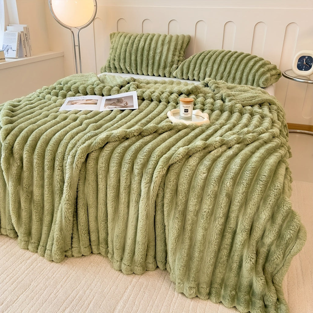 Olive plush blanket showing broad raised stripes