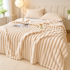 Cream White broad ribbed blanket on a bed