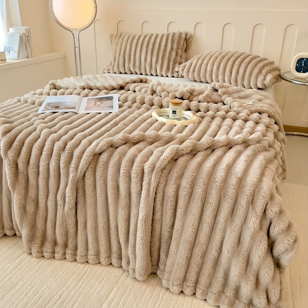 Khaki broad ribbed blanket on a bed