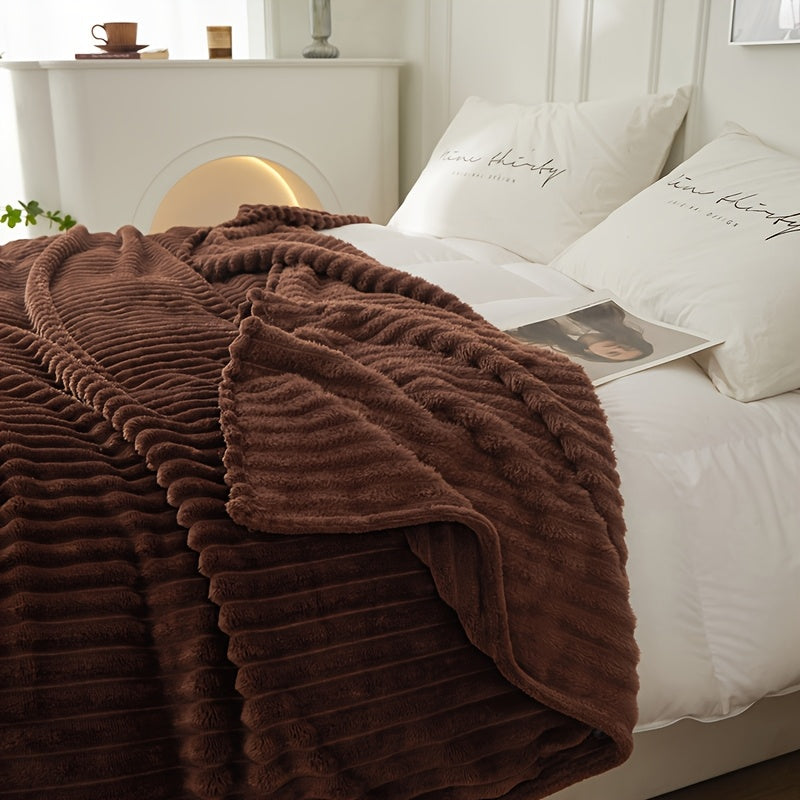 Coffee brown ribbed blanket spread across a bed