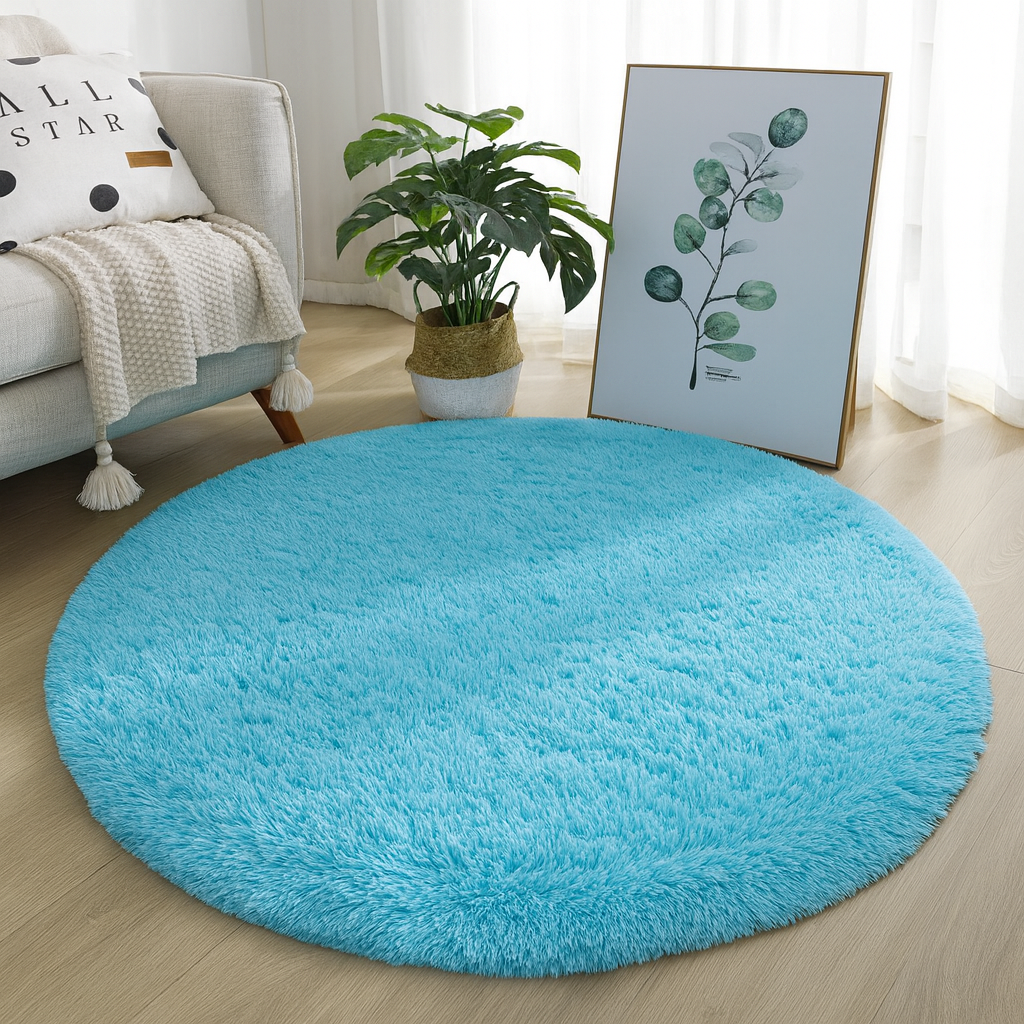 Light blue round area rug with a textured surface.