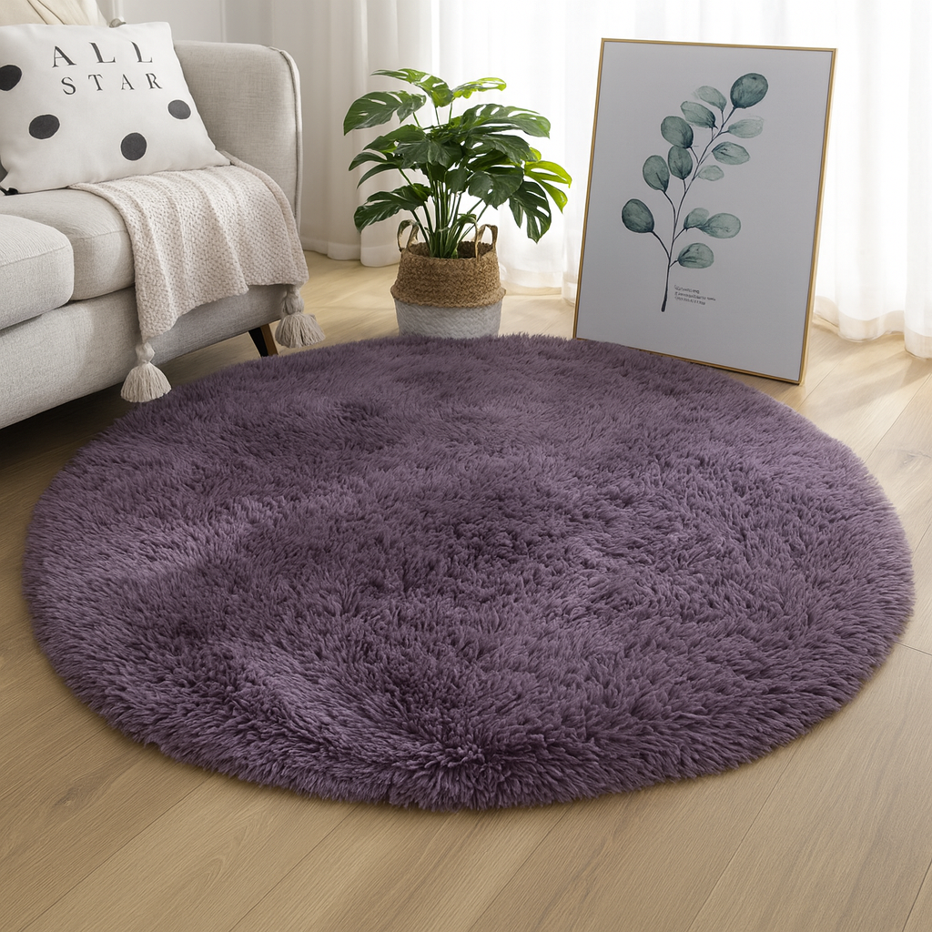 Deep purple round area rug shown in a bright interior.