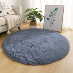 Blue round area rug with a soft circular silhouette.