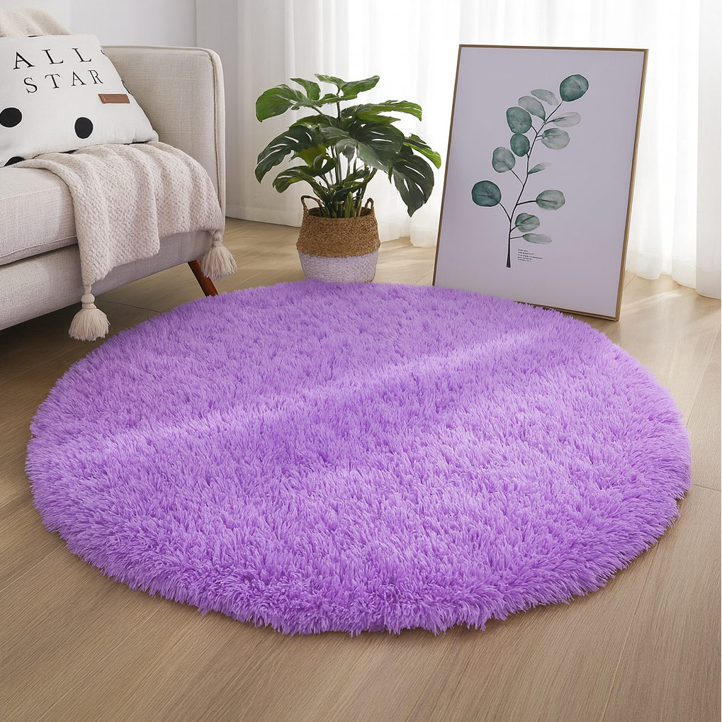 Purple round area rug styled beside neutral furniture.