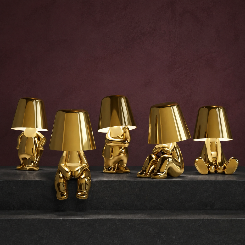 Five gold thinker table lamps arranged on dark basalt steps