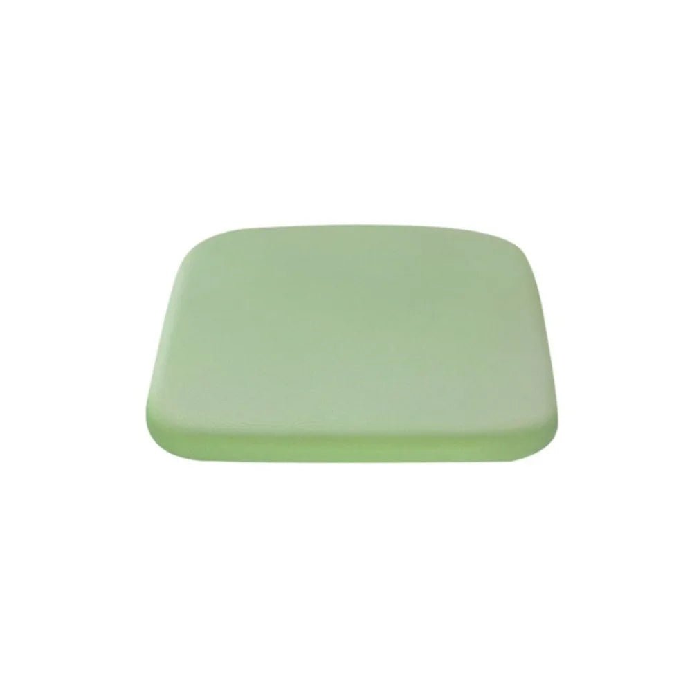 Seat cushion in light green isolated on a white background.