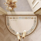 Patterned semicircle door mat with decorative border and lettering.