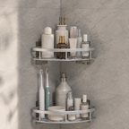 Shower shelf set with two silver corner tiers holding bottles on gray tile