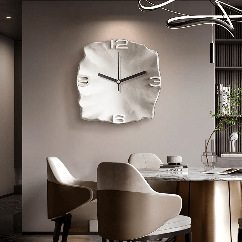 White sculpted wall clock in a modern dining room