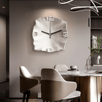 White sculpted wall clock in a modern dining room