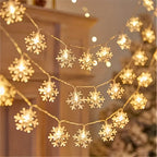 Warm yellow snowflake string lights in a decorative display