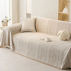 Sofa cover in almond cream covering a sofa in a bright living room.