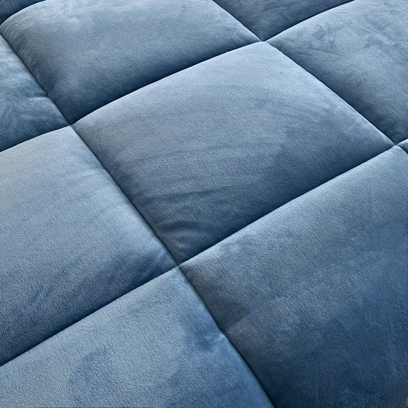 Close-up of the blue box-quilted stitching