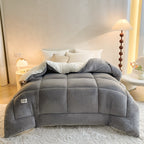 Light gray plush comforter with folded fleece reverse