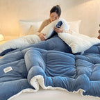 Blue comforter displaying its ivory reverse