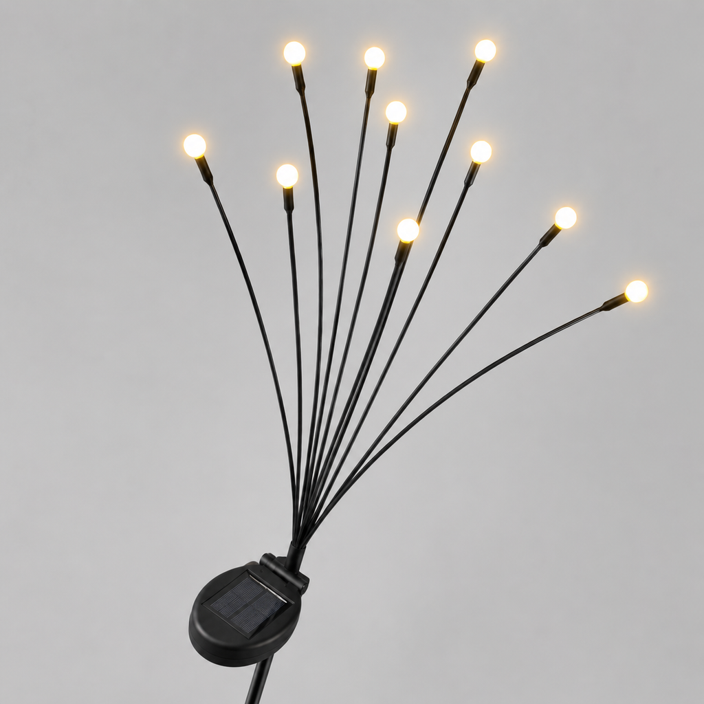Solar-powered fiber optic string lights with multiple thin black wires ending in glowing warm white bulbs, mounted on a small black solar panel against a light gray background.