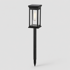 A black solar-powered outdoor landscape light with a rectangular glass lantern-style shade and a stake base, shown against a light gray background.