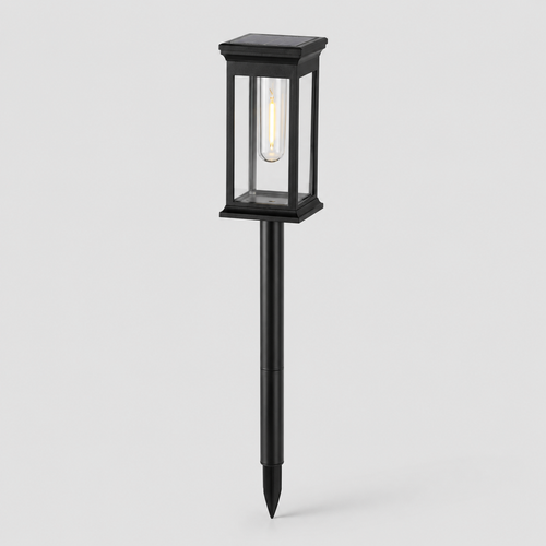 A black solar-powered outdoor landscape light with a rectangular glass lantern-style shade and a stake base, shown against a light gray background.