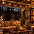Solar string lights glowing above a covered patio seating area at night.