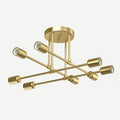 Gold Sputnik ceiling light with eight exposed bulb sockets against a plain background.
