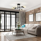 Black Sputnik ceiling light with eight bulbs above a modern seating area.