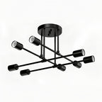 Black Sputnik ceiling light with eight exposed bulb sockets against a plain background.