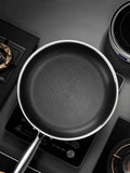 Stainless steel 316 frying pan with a double-sided honeycomb surface, lifestyle view.