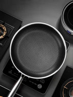 Stainless steel 316 frying pan with a double-sided honeycomb surface, lifestyle view.