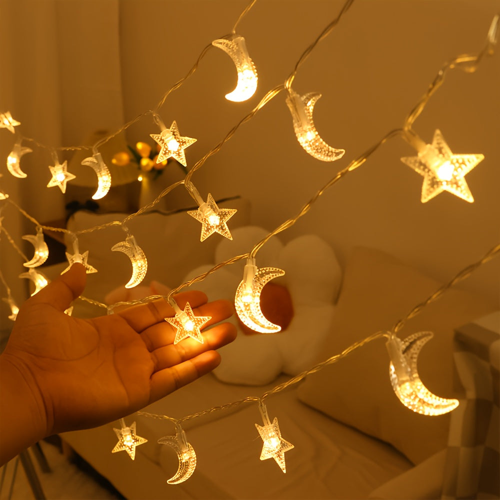 Star and moon fairy lights shown against a hand for scale.