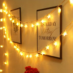 Star fairy lights hang in warm white strands around a bedroom wall.