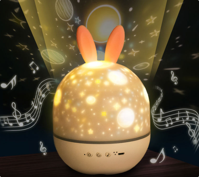 Star projector night light surrounded by projected stars and music graphics
