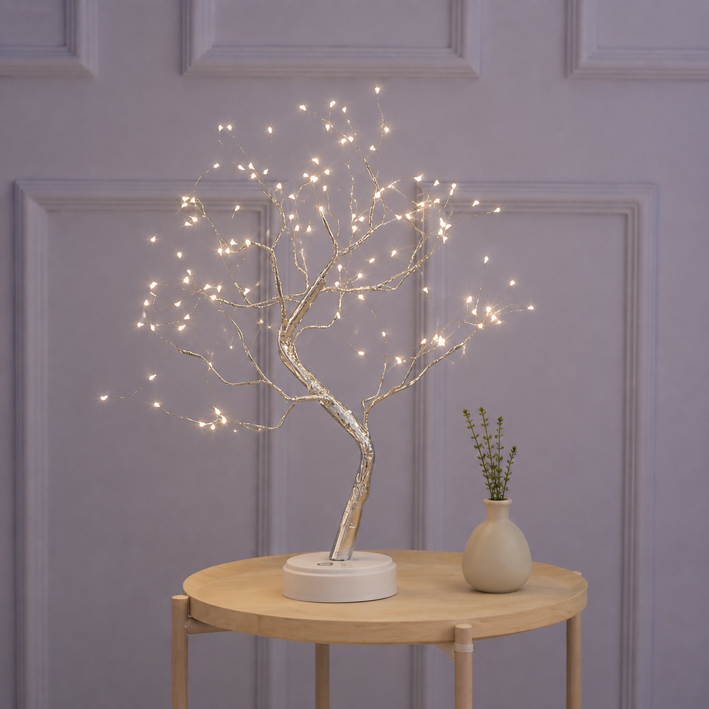 Tree of Light table lamp glowing on a round table against lavender wall trim.