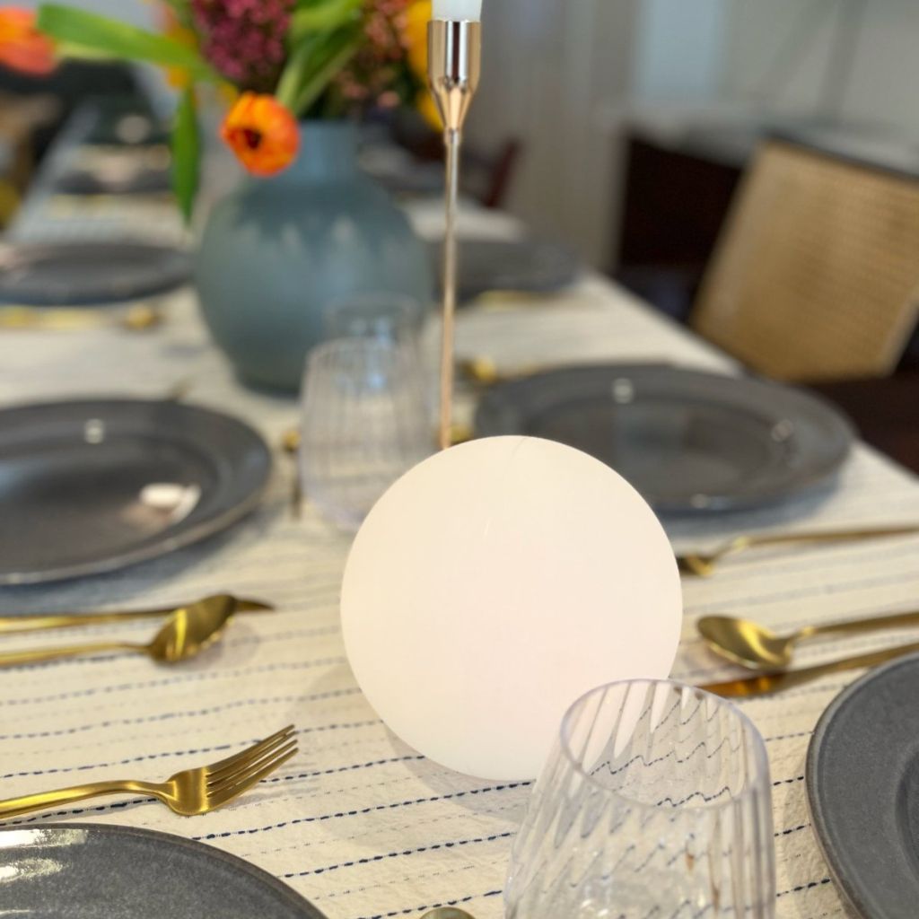 Portable moon light with a soft orange glow.