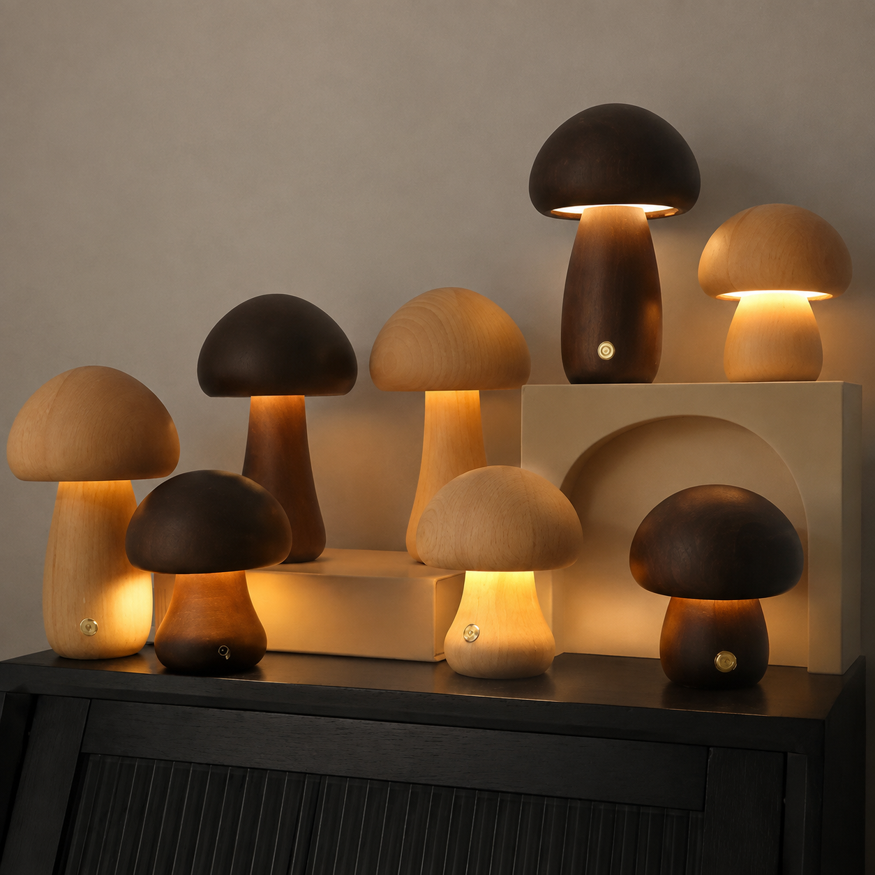 Wooden mushroom table lamp collection in dark and light brown finishes on a console.