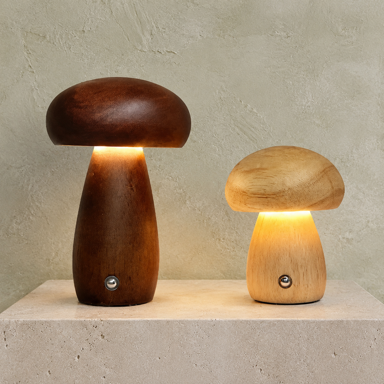 Wooden mushroom table lamp pair in dark and light brown on a stone plinth.