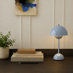 light blue dome table lamp styled beside blank books