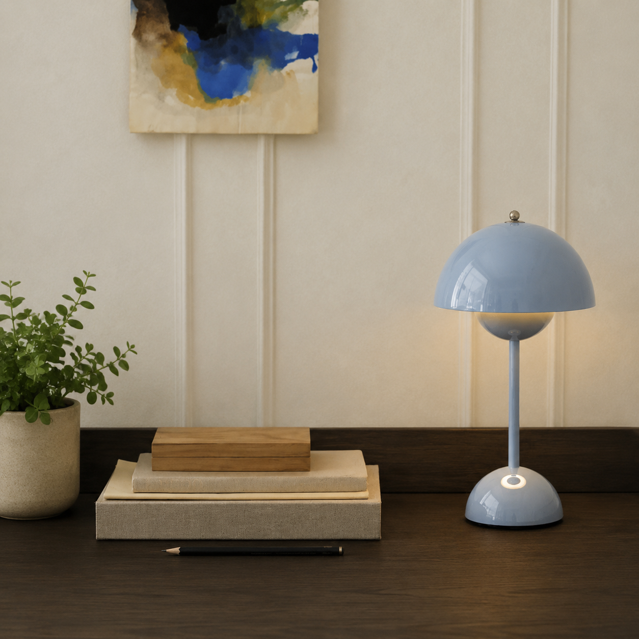 light blue dome table lamp styled beside blank books