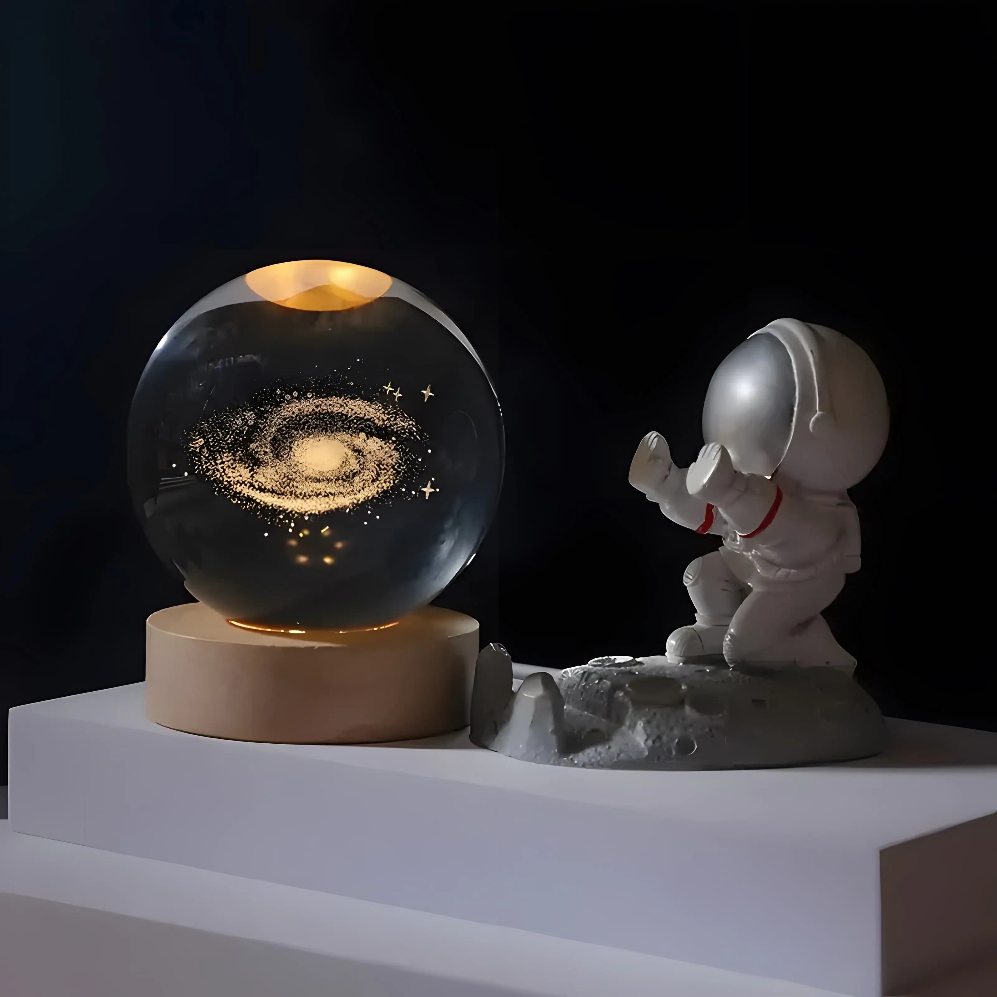 Crystal sphere table lamp with galaxy engraving on a wooden light base