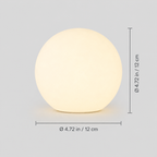 Dimensions graphic showing the round table lamp with width and height measurement lines.
